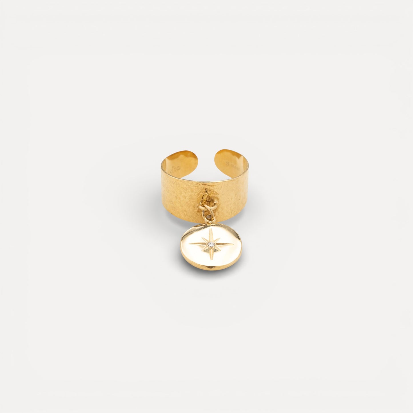 Bague ajustable graphique martelée étoilée en acier doré